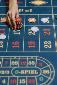 A Person Betting Chips in the Casino