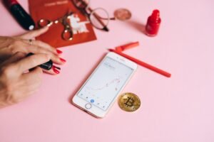 A Person Putting Nail Polish with Bitcoin